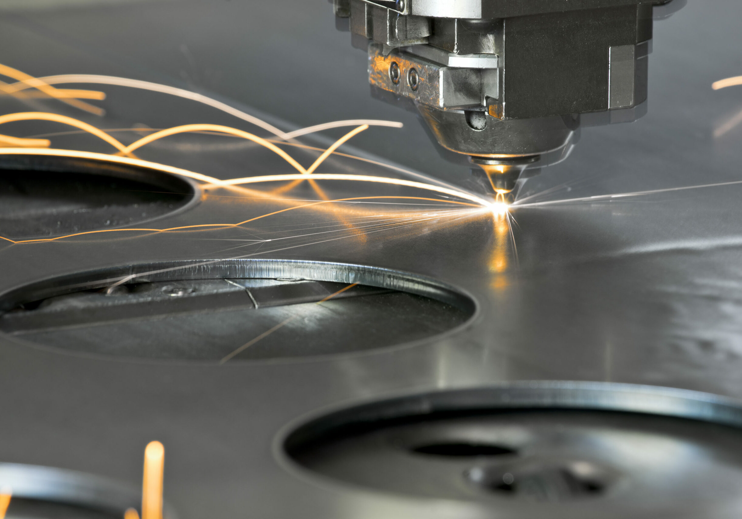 Laser metal cutting manufacturing tool in operation.